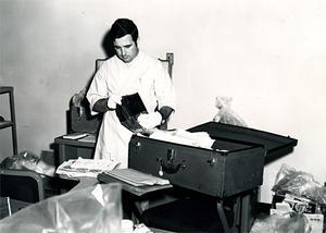 Noel inspects Weather Underground members' belongings during a 1971 apartment search